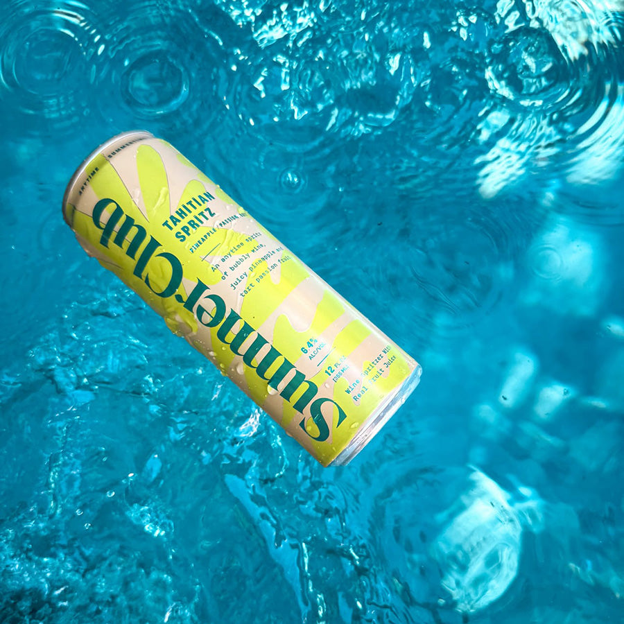 Summer Club can floating in clear blue water